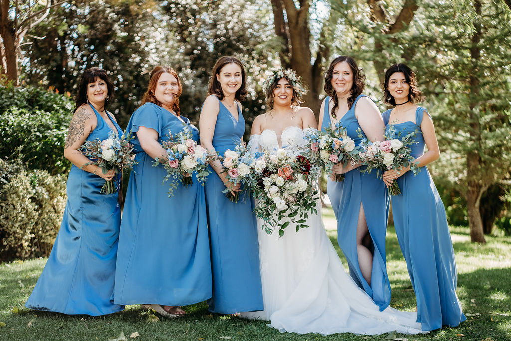 bridal party in power blue, bridal party and bride