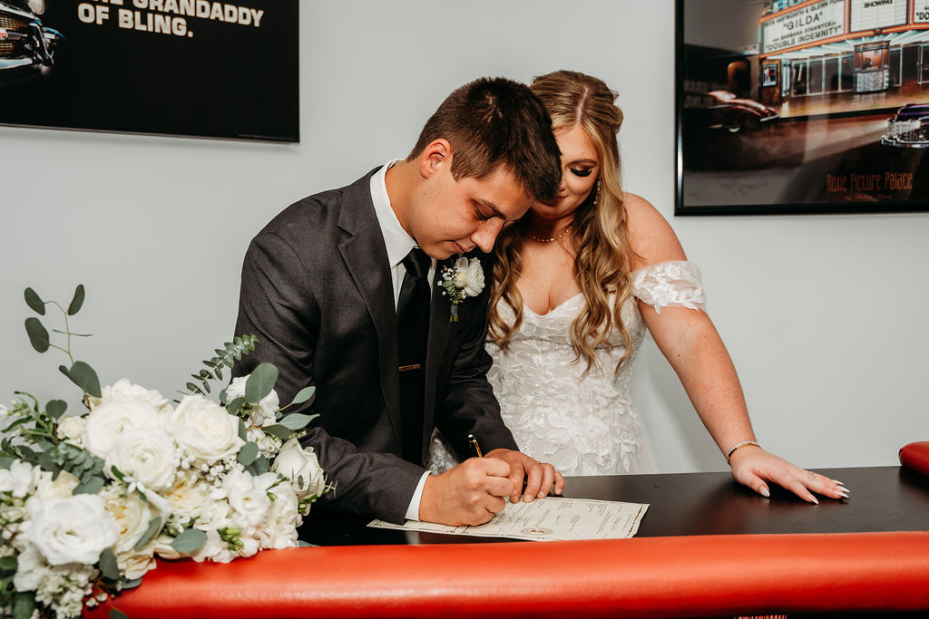 martin auto museum wedding, wedding ceremony, signing wedding license