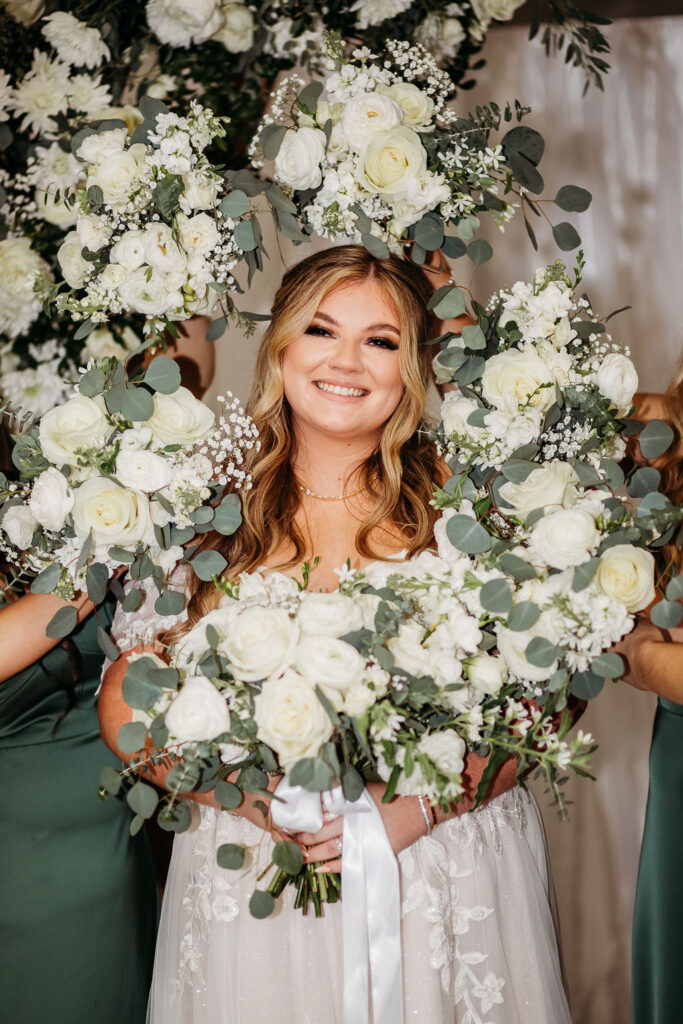 bridal portrait, bride with bridal party bouquets