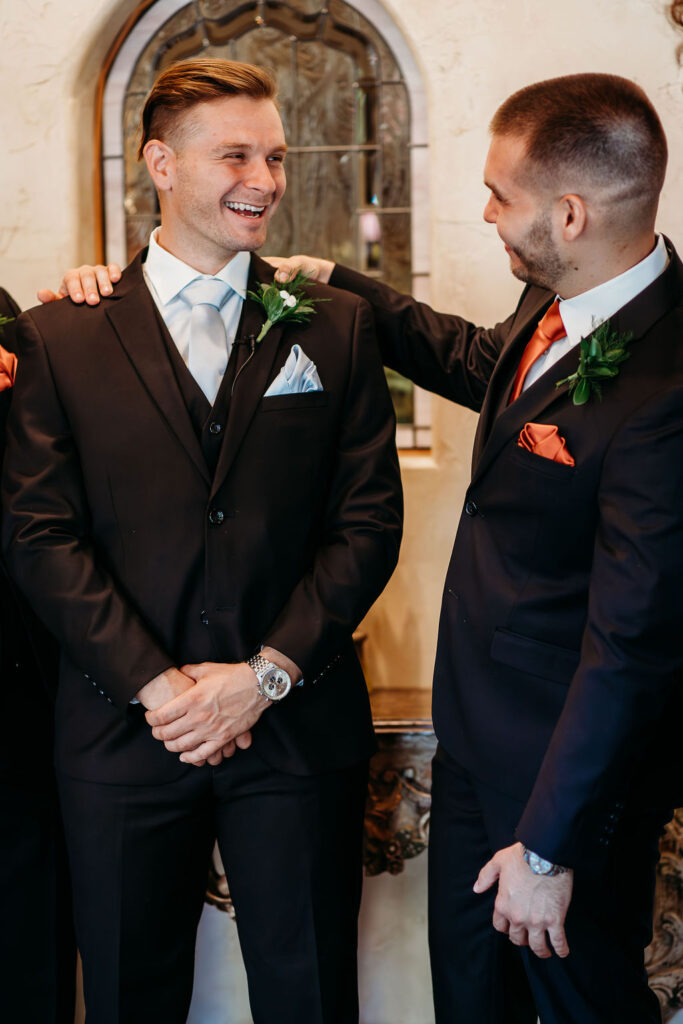 groom with groomsmen, burnt orange tie