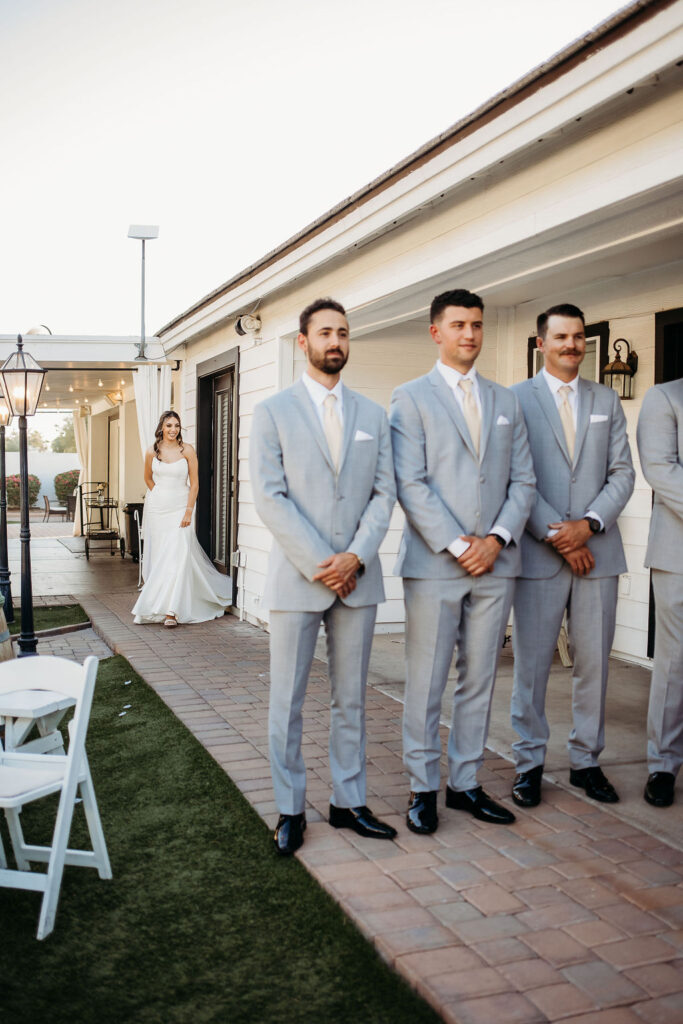 first look with groomsmen at the cottage in gilbert, arizona
