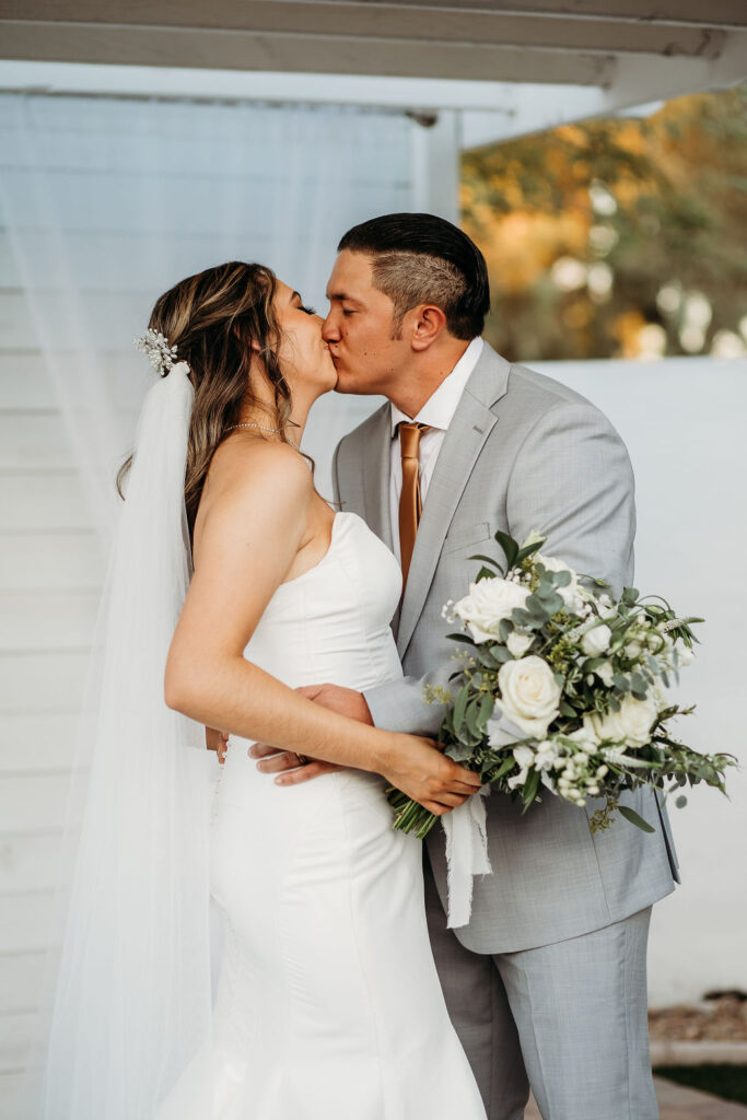 arizona wedding at the cottage in gilbert, wedding ceremony in arizona, kiss the bride