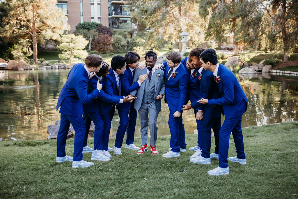 groomsmen in navy blue tux, groomsmen portraits at japanese wedding garden in arizona