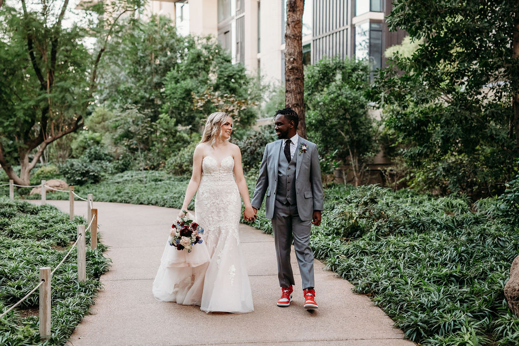 Bride and groom portraits at Japanese Friendship Garden Arizona. sweetheart cut wedding dress, groom in grey tux, wedding couple poses