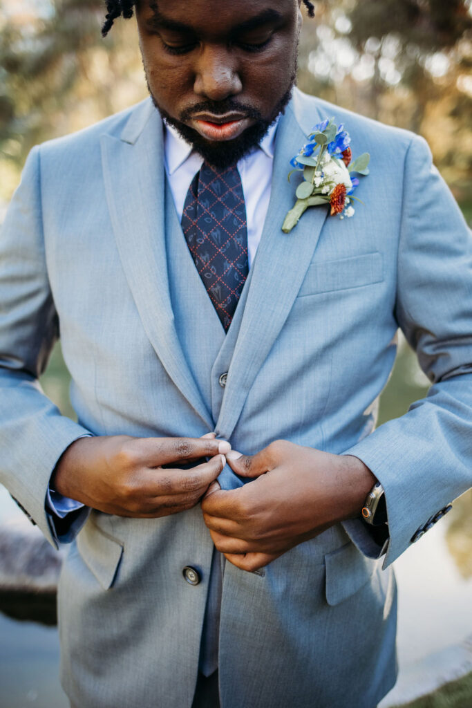 groom portraits at Japanese Friendship Garden Arizona. groom in grey tux and sneakers