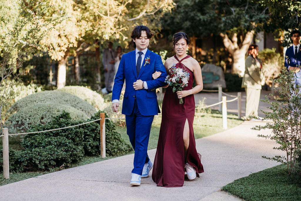 ceremony photos at Japanese Friendship Garden Arizona. Wedding party in navy blue tux and maroon bridesmaid dress