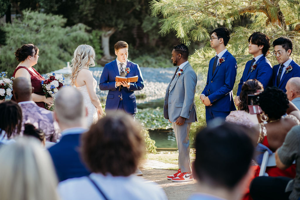 ceremony photos at Japanese Friendship Garden Arizona. grey and navy blue tux