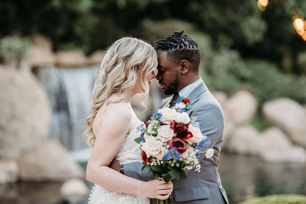 Bride and groom portraits at Japanese Friendship Garden Arizona. sweetheart cut wedding dress, groom in grey tux, wedding couple poses