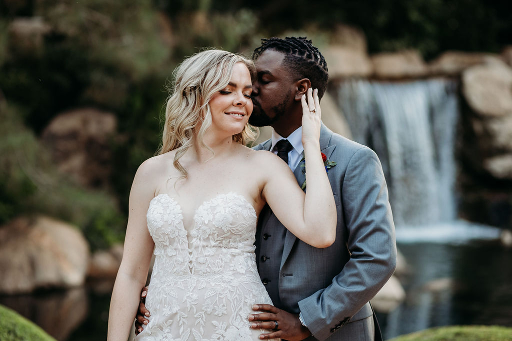 Bride and groom portraits at Japanese Friendship Garden Arizona. sweetheart cut wedding dress, groom in grey tux, wedding couple poses