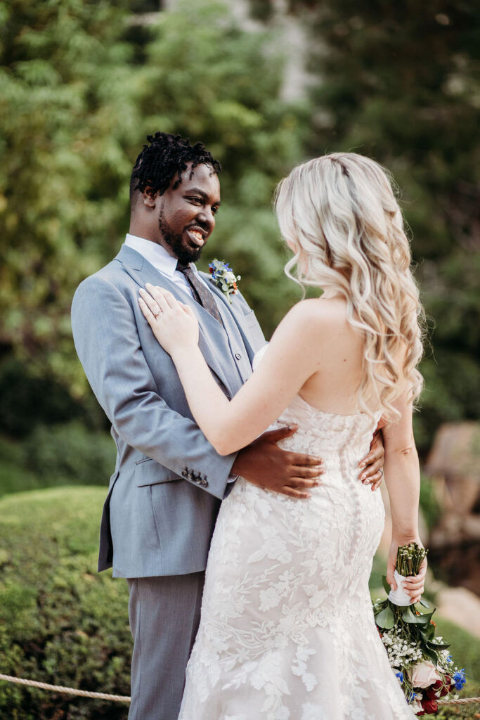 Bride and groom portraits at Japanese Friendship Garden Arizona. sweetheart cut wedding dress, groom in grey tux, wedding couple poses