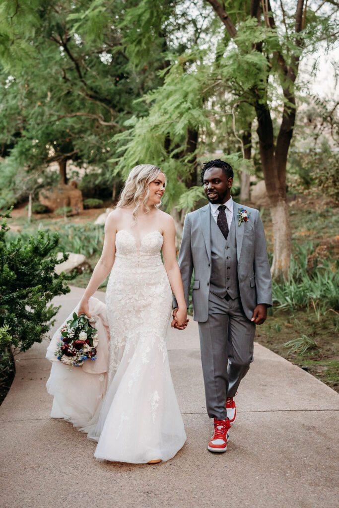 Bride and groom portraits at Japanese Friendship Garden Arizona. sweetheart cut wedding dress, groom in grey tux, wedding couple poses