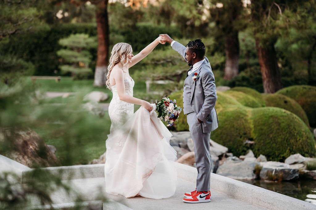 Bride and groom portraits at Japanese Friendship Garden Arizona. sweetheart cut wedding dress, groom in grey tux, wedding couple poses