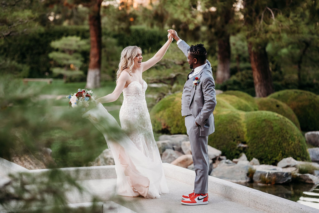 Bride and groom portraits at Japanese Friendship Garden Arizona. sweetheart cut wedding dress, groom in grey tux, wedding couple poses