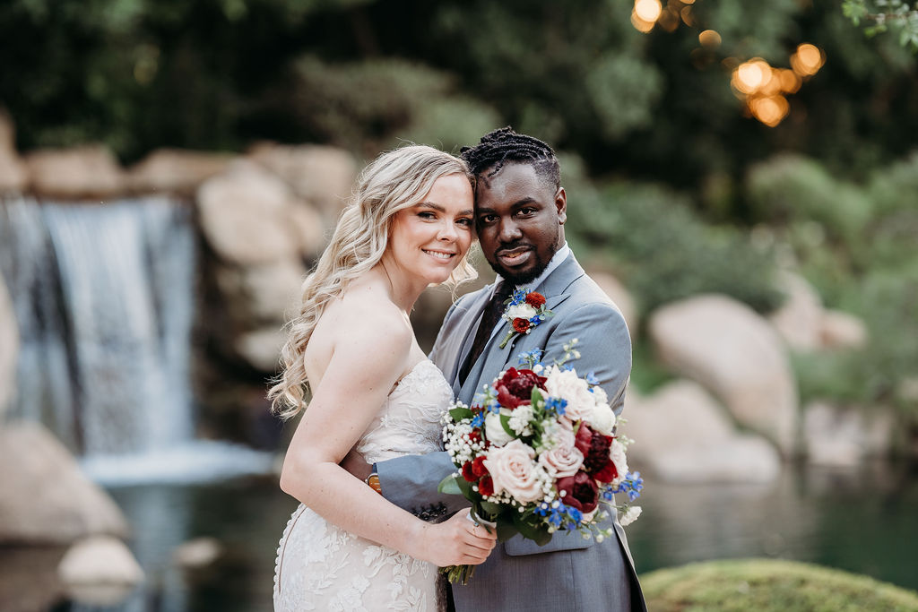 Bride and groom portraits at Japanese Friendship Garden Arizona. sweetheart cut wedding dress, groom in grey tux, wedding couple poses