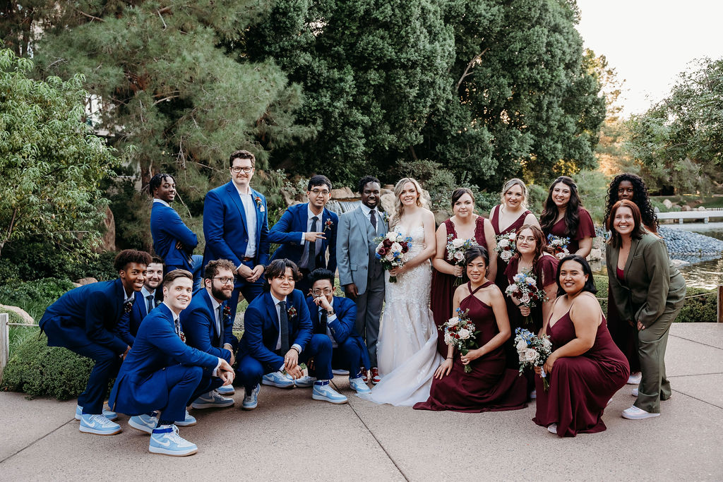 wedding party portraits at Japanese Friendship Garden Arizona. bridal party in maroon dresses, groomsmen in navy blue tux