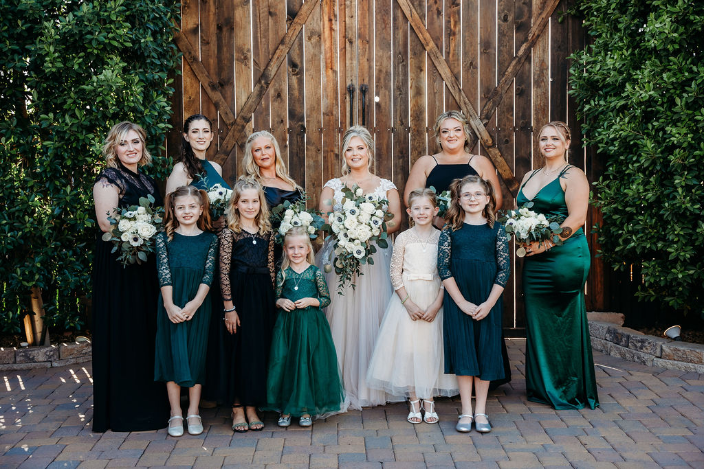 venue at chilleens, arizona wedding photographer, wedding party photos, white poppy bouquet, emerald bridesmaid dresses