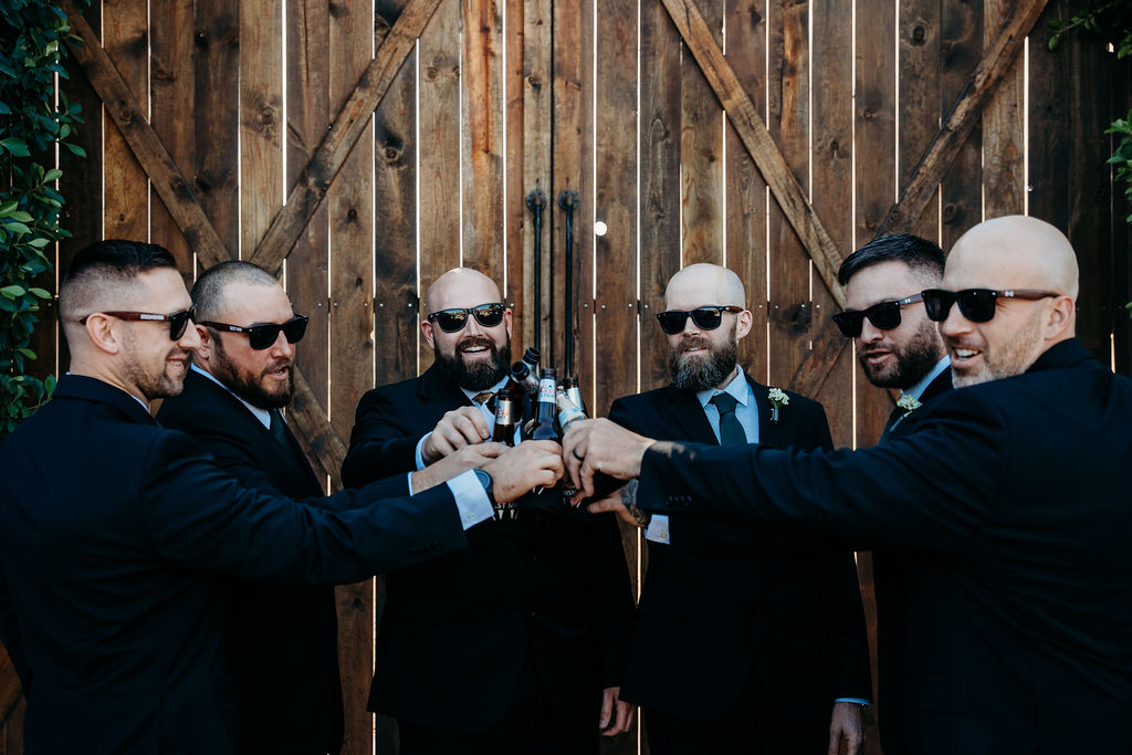 venue at chilleens, arizona wedding photographer, groom and groomsmen with beer, groomsmen portraits