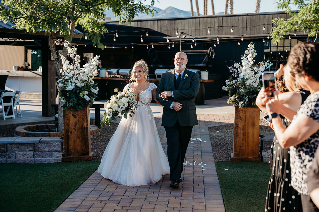 venue at chilleens, arizona wedding photographer, fatehr walking bride down aisle