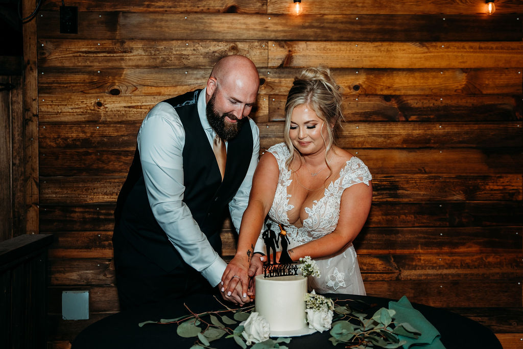 venue at chilleensreception, arizona wedding photographer, bride and groom cutting cake, wedding cake topper