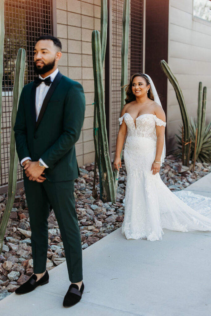 first touch with groom, forest green tux, cactus wedding portrait, first look ideas