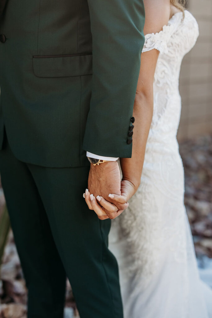 first touch with groom, forest green tux, cactus wedding portrait