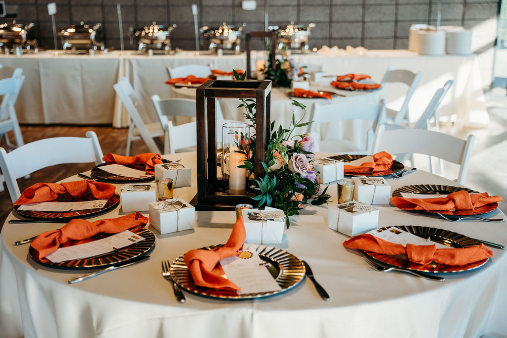 wedding table scape with burnt orange and gold plates