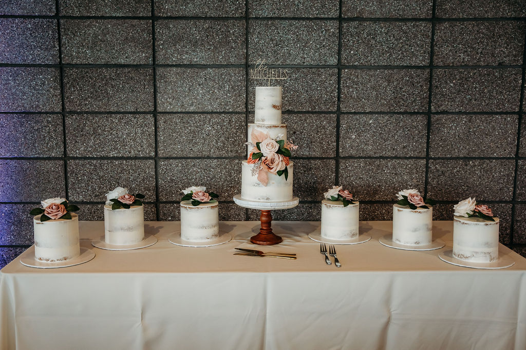 naked wedding cake with blush rose florals