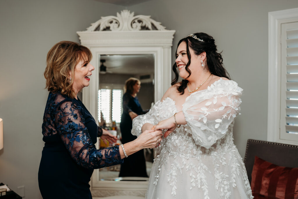 Bride getting ready, arizona wedding photographer. Sweetheart wedding dress with delicate puff shoulder sleeves with intricate leaf details.