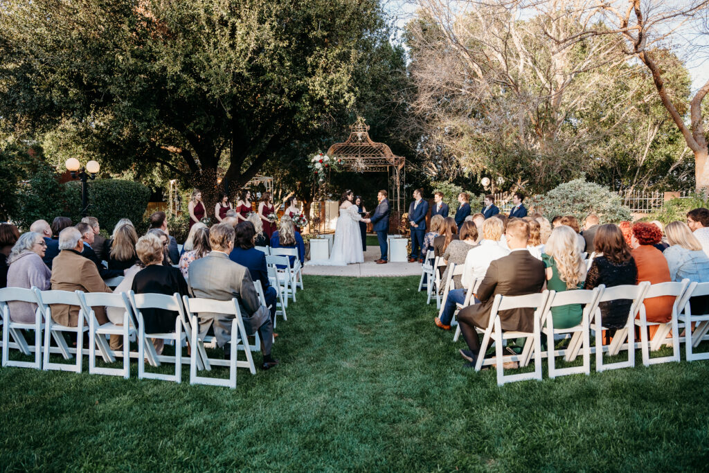 Wedding ceremony by arizona wedding photographer at Stonebridge Manor.