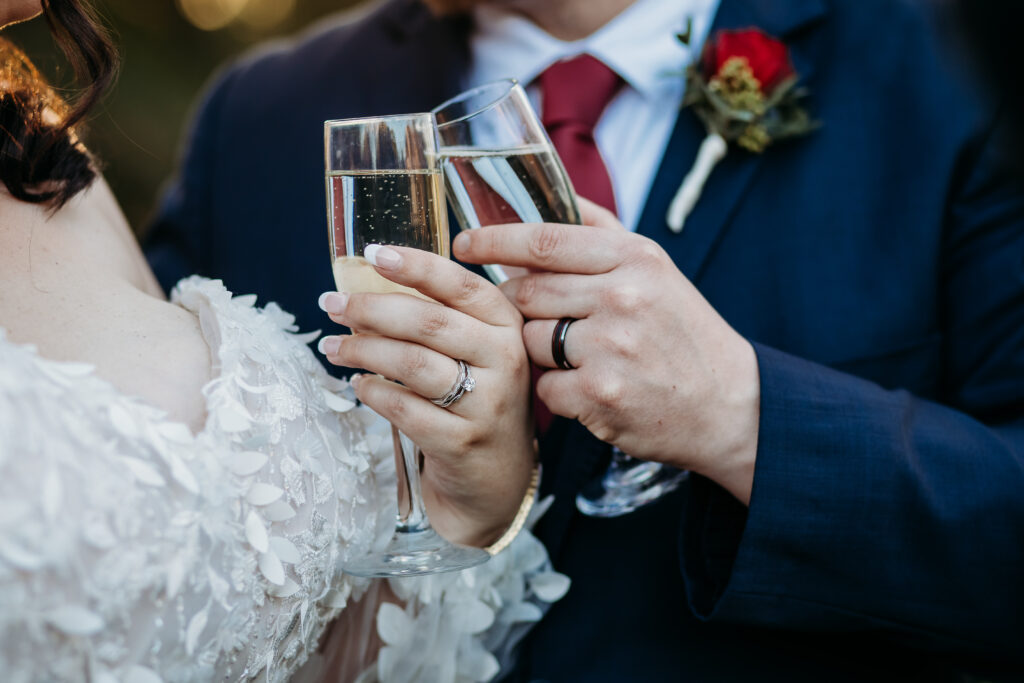 Bride and groom toasting with champagne. Arizona wedding photographer.