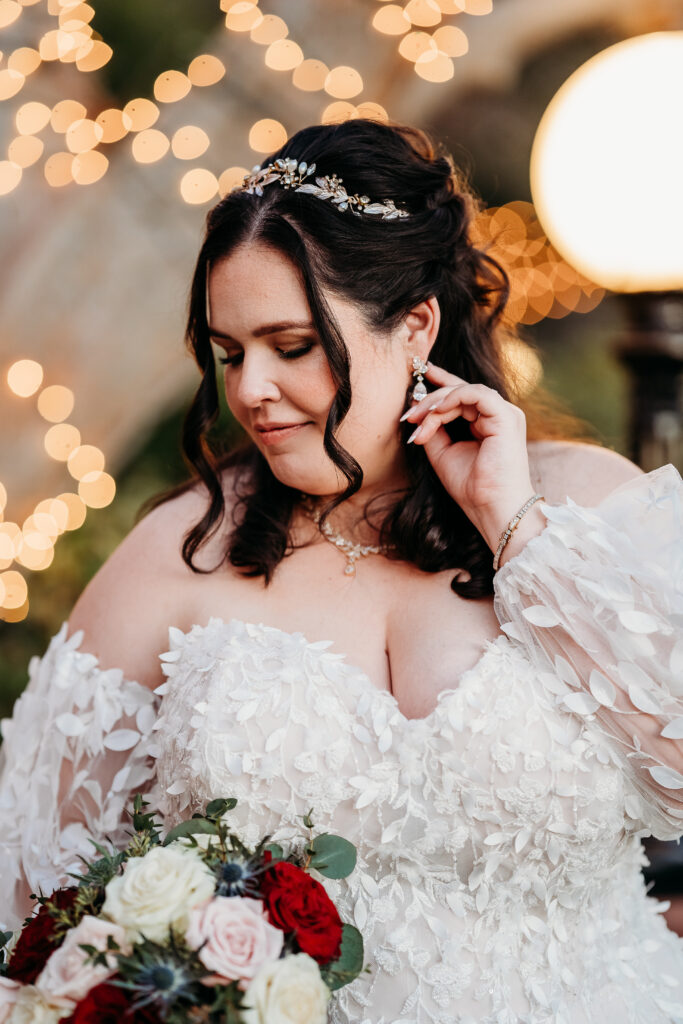 Bride and groom at Stonebridge Manor.  Wedding dress is sweetheart with delicate puff shoulder sleeves with intricate leaf details.