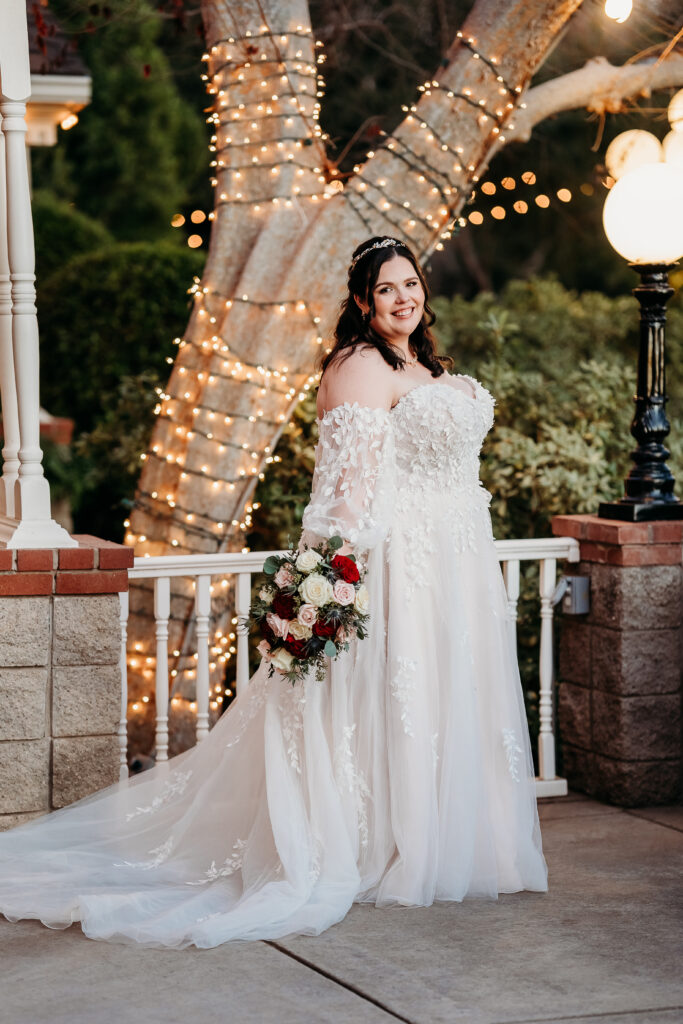 Bride and groom at Stonebridge Manor. Wedding dress is sweetheart with delicate puff shoulder sleeves with intricate leaf details.