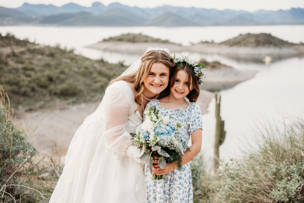 Desert Outdoor Center at Lake Pleasant, bride with flower girl poses, flower girl in blue floral print