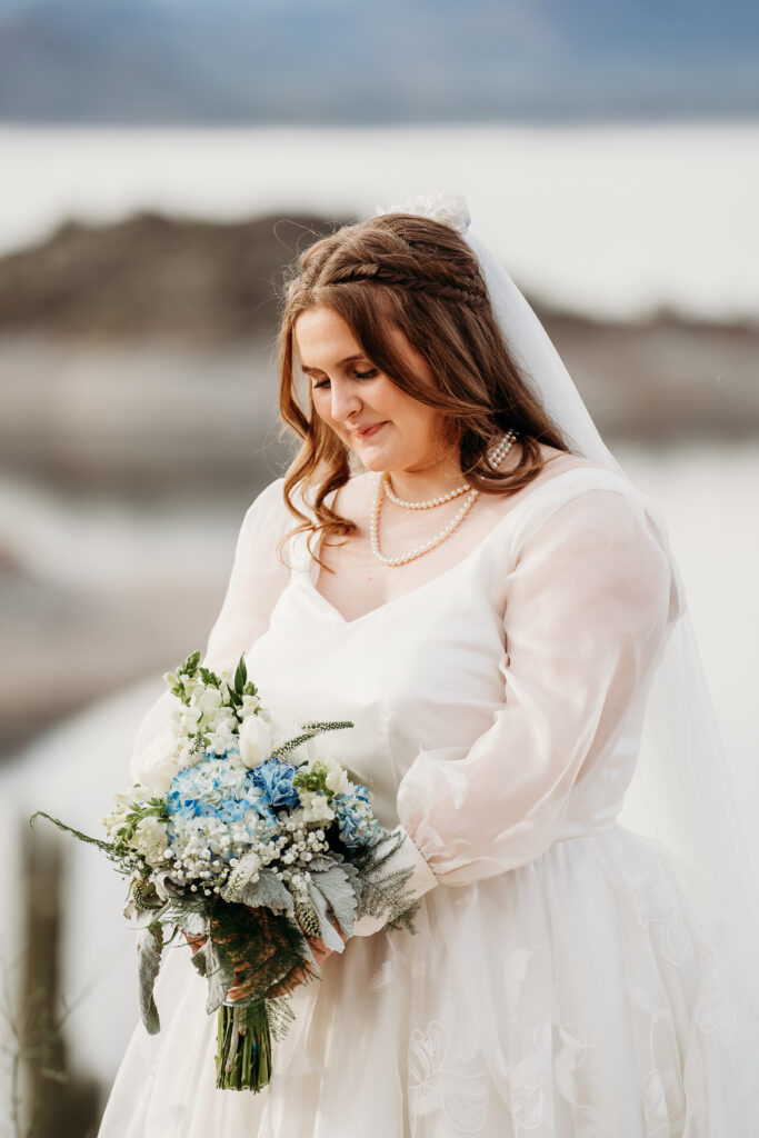 Desert Outdoor Center at Lake Pleasant, bridal portrait poses, white roses with blue hydrangea and baby breath bouquets