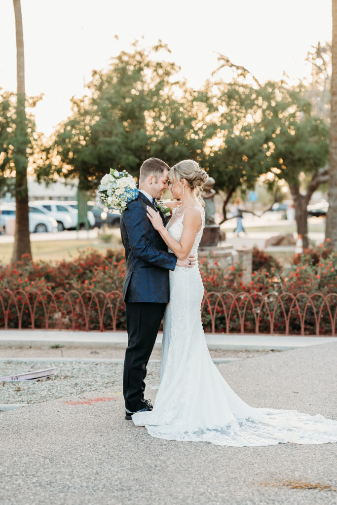 Fire House Event Center, arizona wedding photographer, wedding formal photo poses, bride and groom posing ideas, sleeveless lace gown with a deep V-neckline