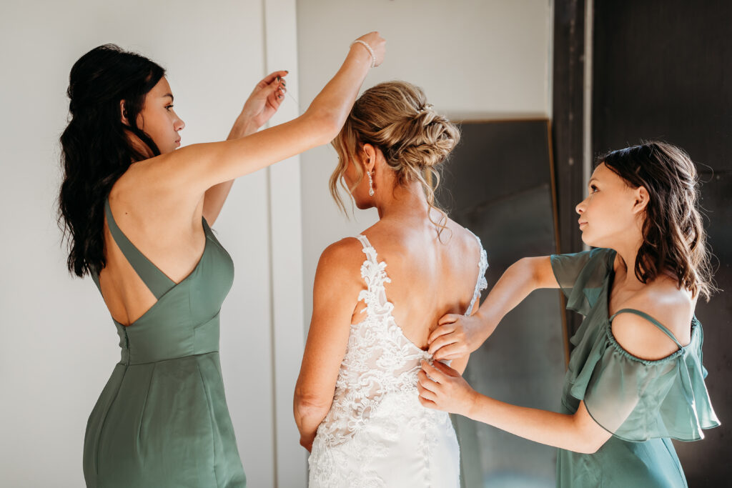 bride getting ready, arizona wedding photographer, sleeveless lace gown with a deep V-neckline