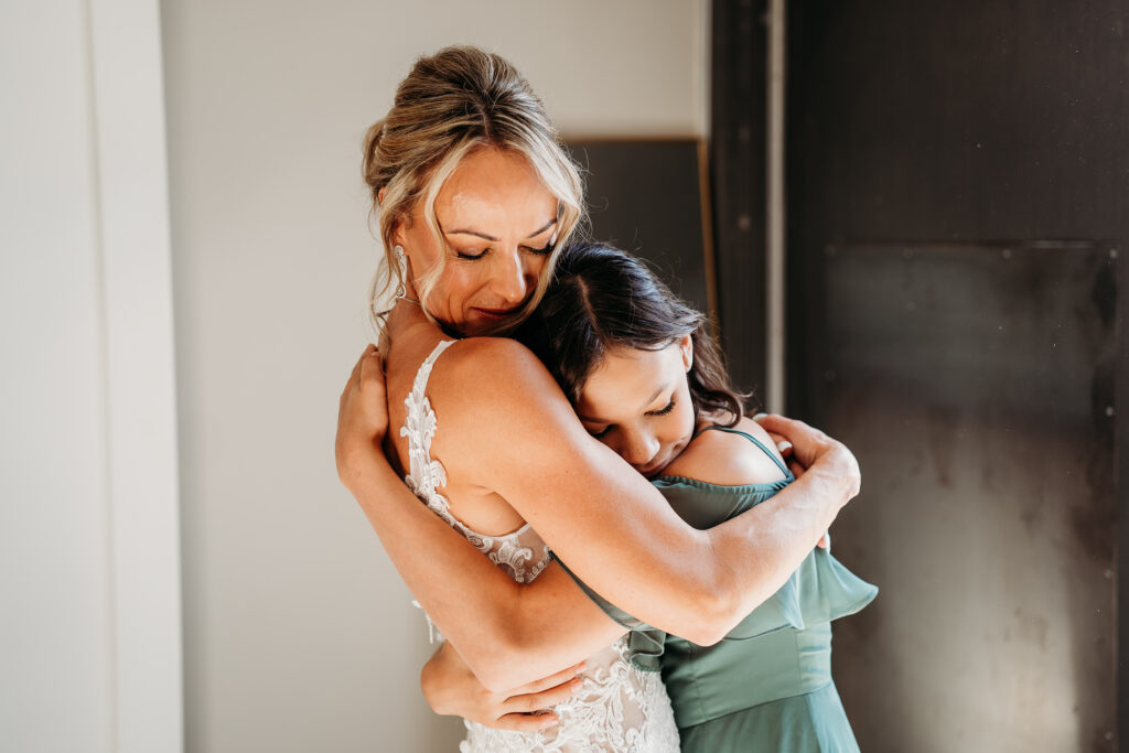 bride getting ready, arizona wedding photographer, sleeveless lace gown with a deep V-neckline