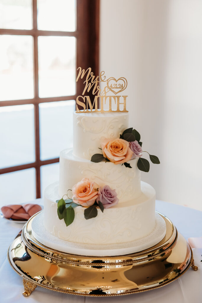 wedding cake, simple white cake with roses, rose colors or lilac and peach