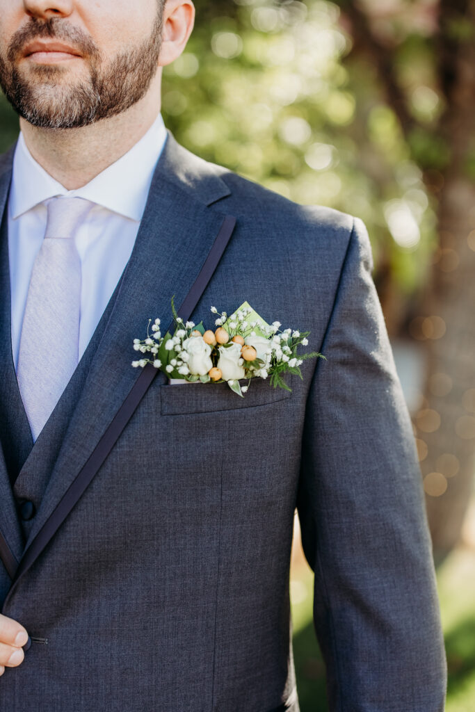 Groom in grey suit at secret garden, arizona wedding photographer