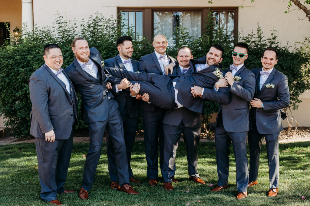 Secret Garden in Arizona, groomsmen in grey suits, poses for groom and groomsmen