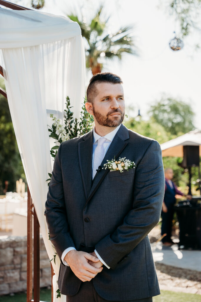 Ceremony at Secret Garden in Arizona, arizona wedding photographer, groom waiting for bride