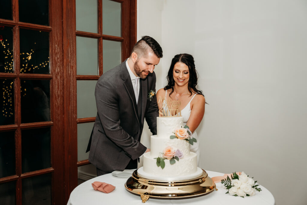  Reception at Secret Garden in Arizona, arizona wedding photographer, bride and groom cutting cake