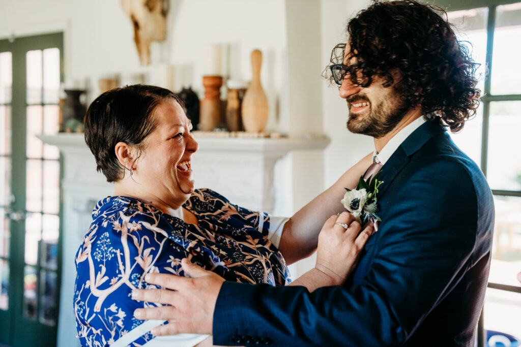 Coronado House Phoenix, Phoenix wedding venues, groom getting ready, groom in navy blue