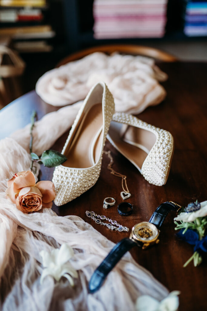 wedding flat lay, ivory heals with pearls