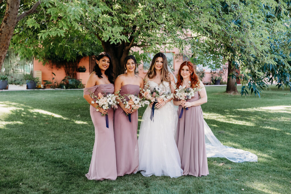 bride and bridesmaid poses, long lilac dresses bridesmaids, arizona wedding photographer