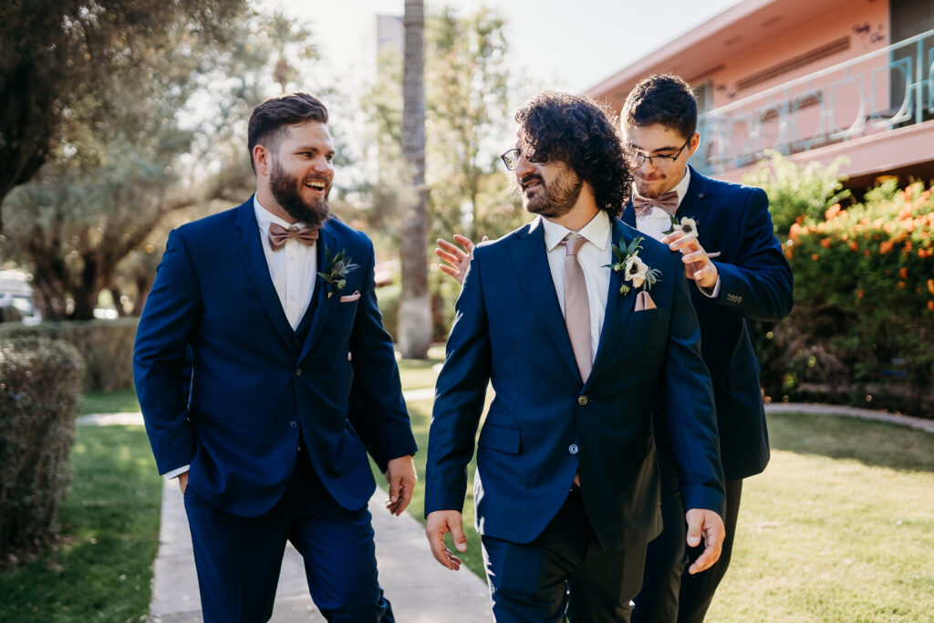 groom and groomsmen getting ready, navy blue tux for groomsmen