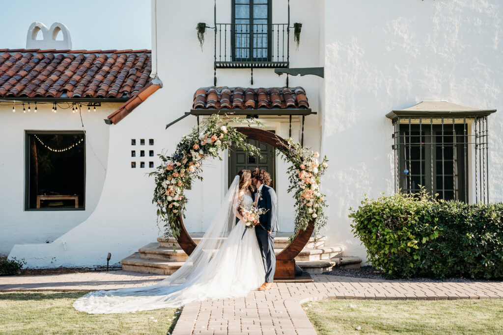 bride and groom portraits, bride and groom poses, circle wedding arch