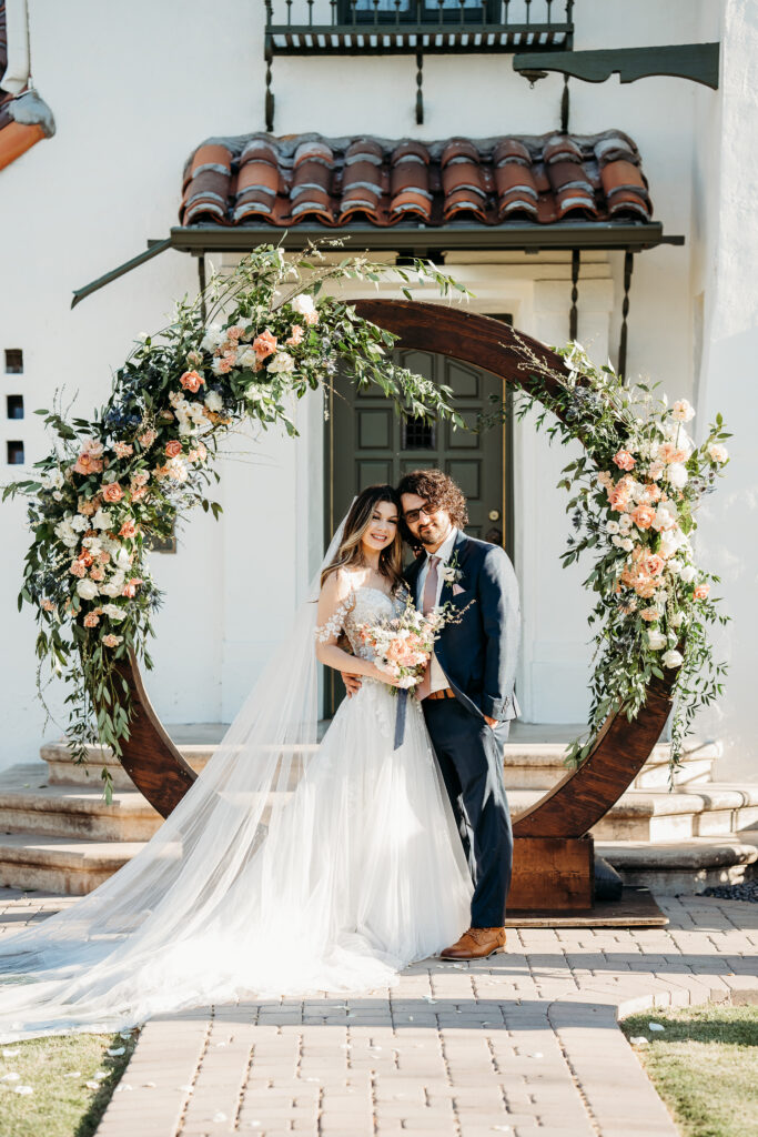 bride and groom portraits, bride and groom poses, circle wedding arch