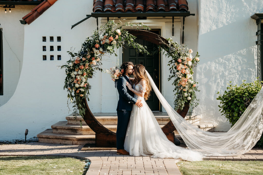 bride and groom portraits, bride and groom poses, circle wedding arch