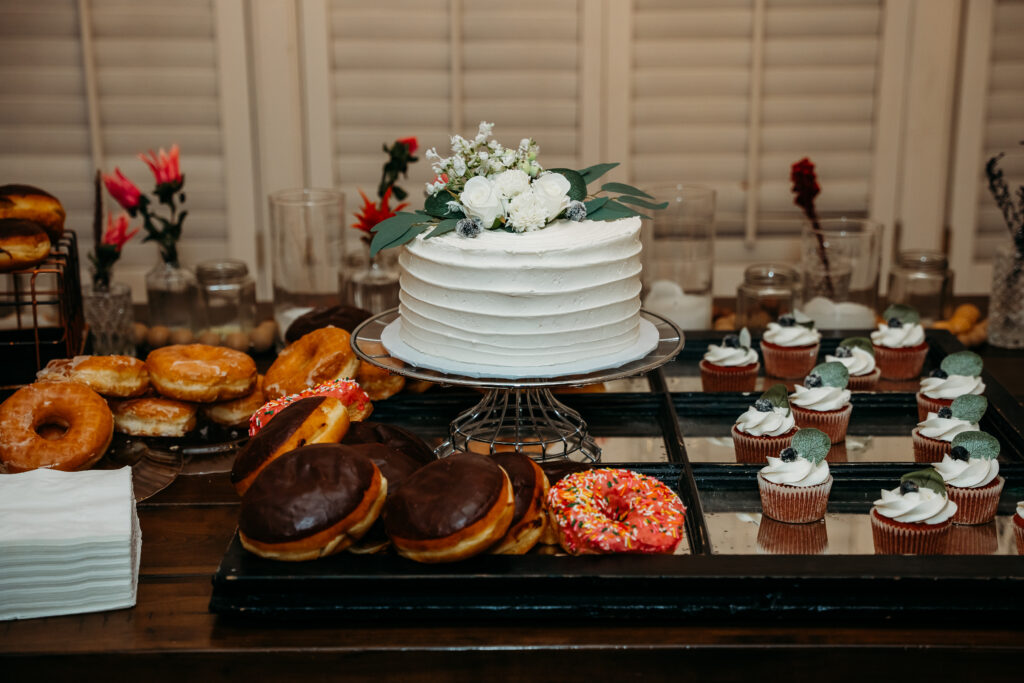 cutting the cake, bride and groom, dessert table for reception